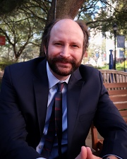 portrait of Nathan Carlin, PhD