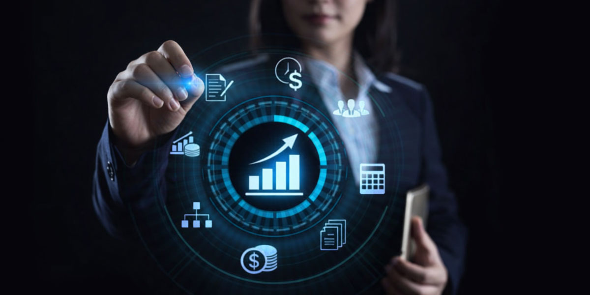 Photo showing a finance officer 'virtually' touching computer icons floating in front of her.