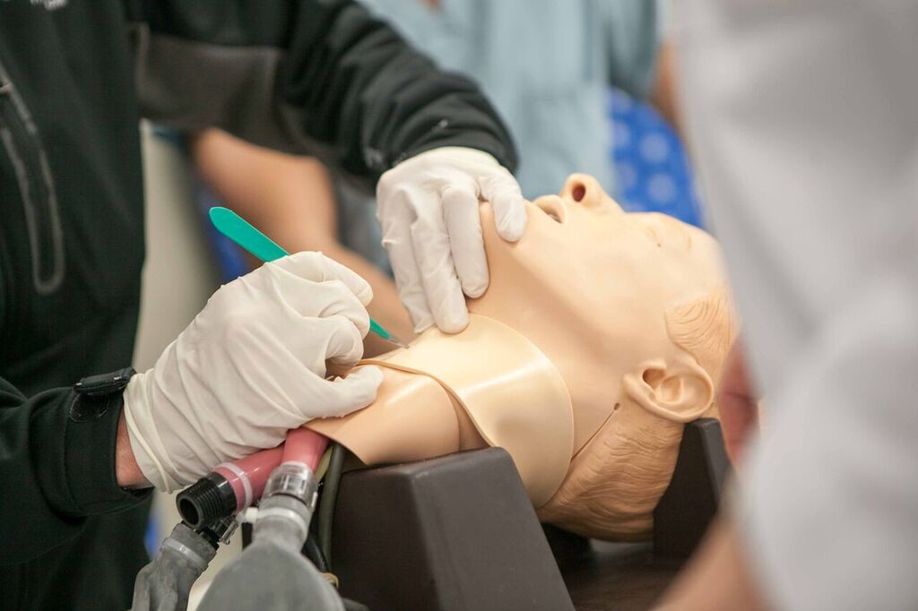 A student learning how to perform a procedure.