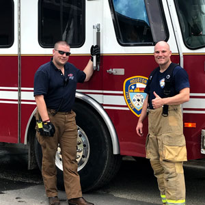 Drs. Schulz and Stephens in front of fire truck