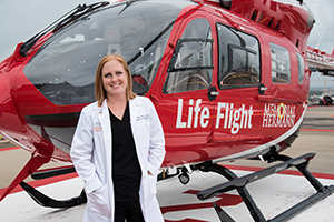 Dr. Osborn in front of a LifeFlight helicopter