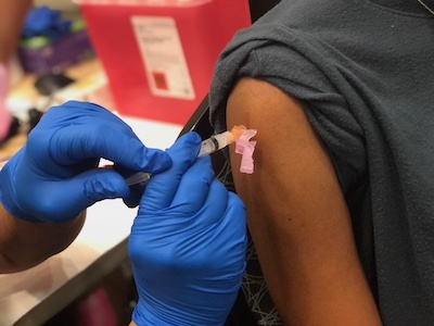 Vaccine being administered