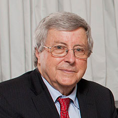 An old man is in black suit.