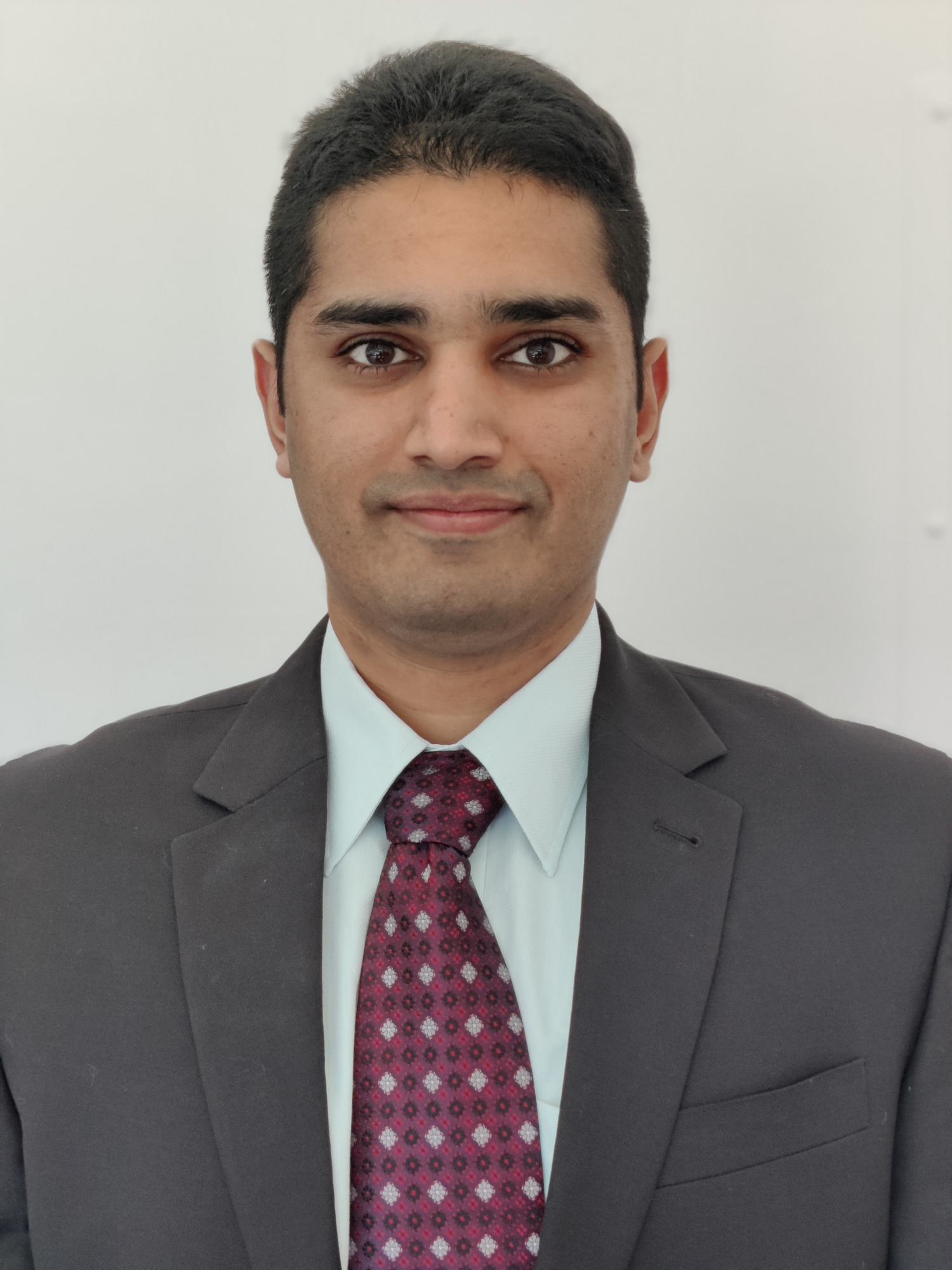 A man wearing a tie in a black suit