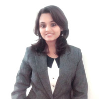 A woman in a gray suit