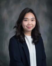 A long hair woman in a black suit