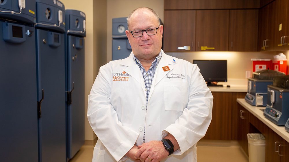 Luis Ostrosky, MD, is professor, Memorial Hermann Chair, and division chief of infectious diseases at McGovern Medical School at UTHealth Houston standing in a blood bank.
