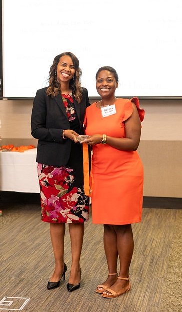 Keisha Ray receives award from Latanya Love