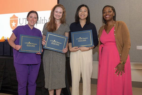 Keisha Ray awards graduating medical students