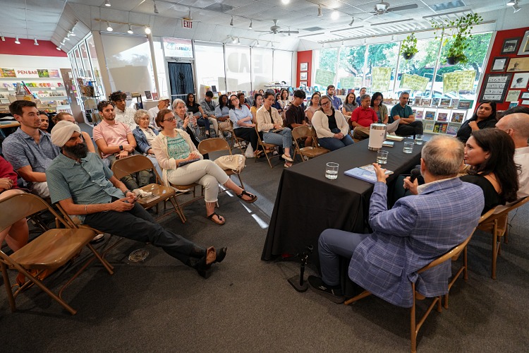 Photo of speakers and audience