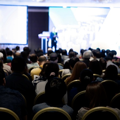 Indescript crowd at a speaking event