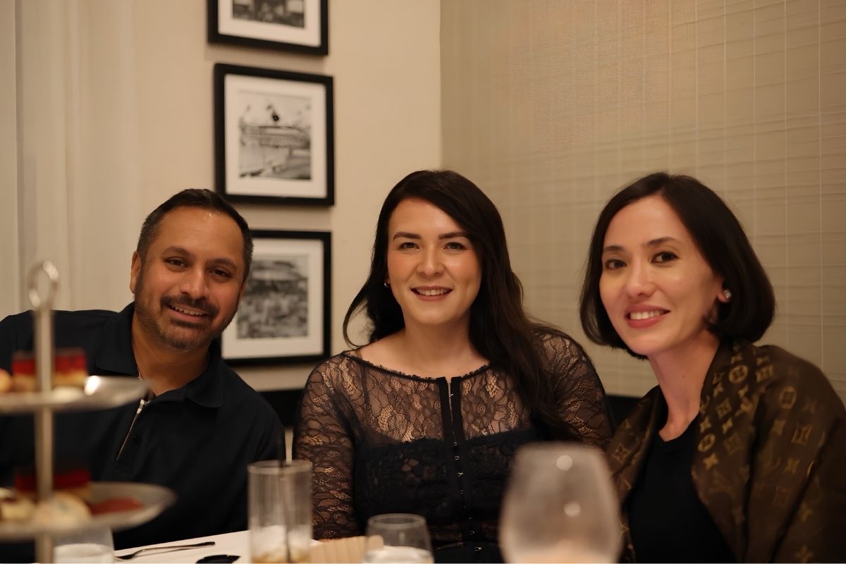 dr vanga, grace and chaveli poses for a pic while at the dinner table