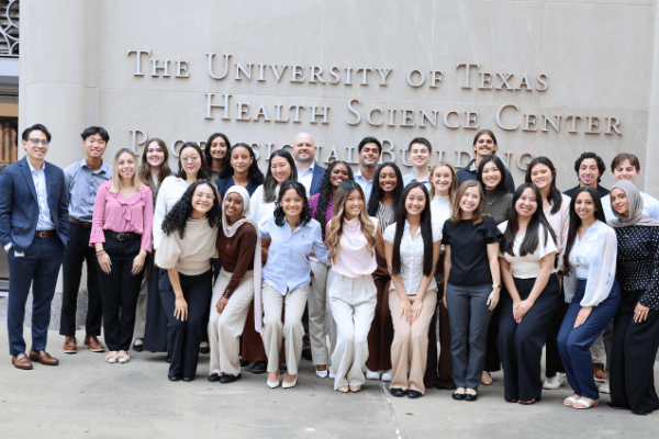 msa program director charlie phung poses with the msa class of 2028 students outside the UTPB