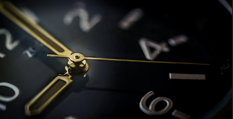 black watch face with gold hands and numbers