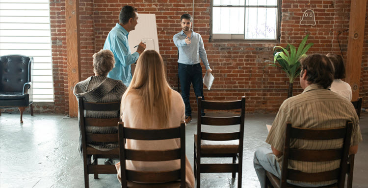 Clinician‑led group discussion in a shared medical appointment, illustrating team‑based care and patient participation.