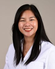 Headshot of a resident smiling at the camera