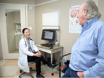 Photo of UTHealth Houston neurologist Christina Kim with a patient.