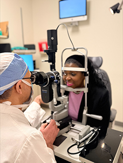 Photo of physician performing an eye examination