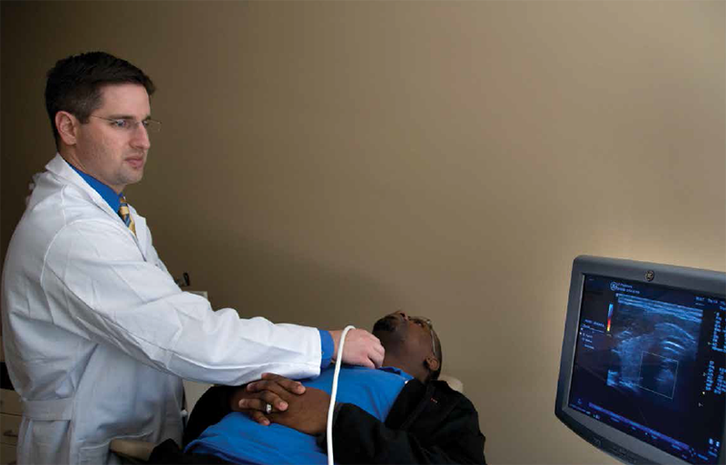 Dr. Karni performing an in-office ultrasound