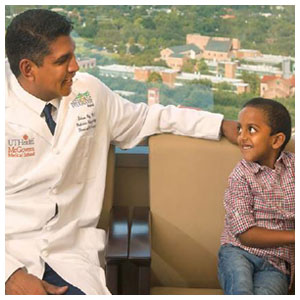 Soham Roy, MD, with patient