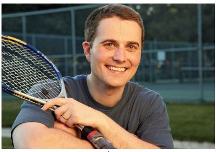 Man holding tennis racquet
