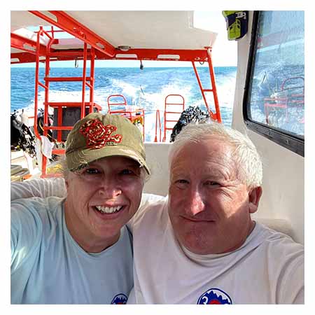 Pam Atherton and her husband on a boat