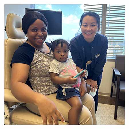 Chidalu Chioma with her mother and Dr. Huang in the exam room