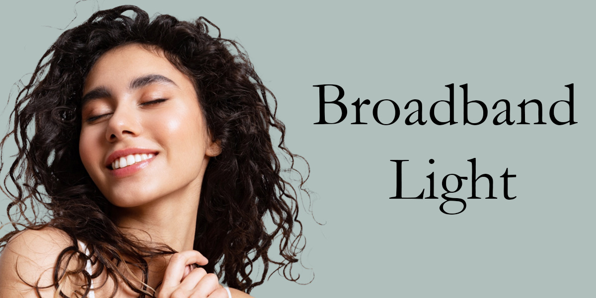 woman with dark curly hair next to the words broadband light