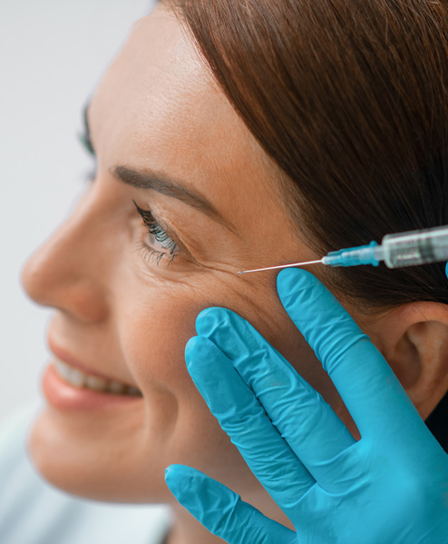 Woman smiling during Dysport anti-wrinkle treatment at Texas Center for Facial Plastic Surgery in Houston