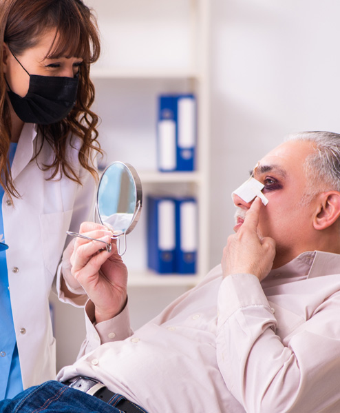 Male patient reviewing facial trauma recovery – Texas Center for Facial Plastic Surgery, Houston