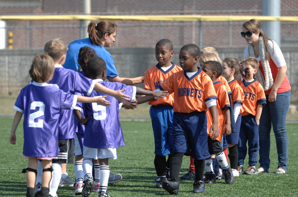 team work children field handshake