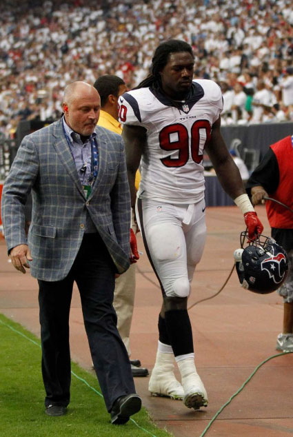 spotlight Texans - Walt Lowe, MD on field with player number 90