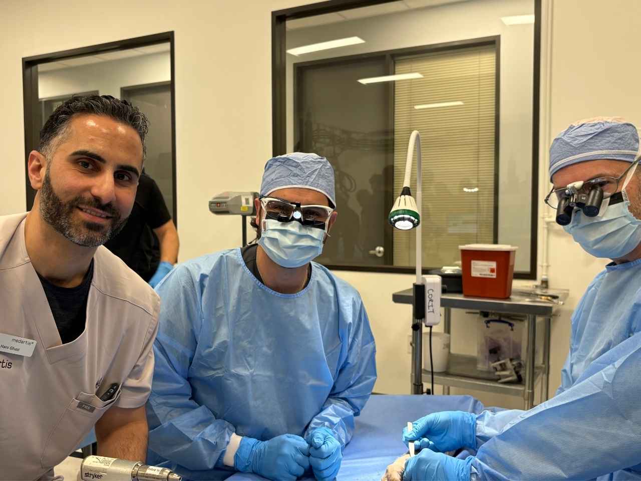 A Medartis representative, left, works with UTHealth Houston hand surgeons James Saucedo, MD, and Dean Smith, MD, during hands-on training focused on thumb CMC arthritis.