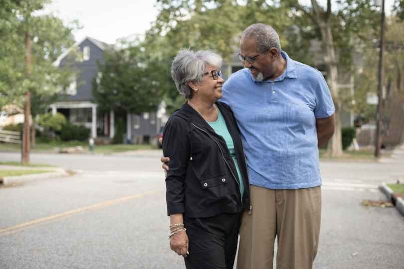 Couple walking confidently after hip replacement surgery