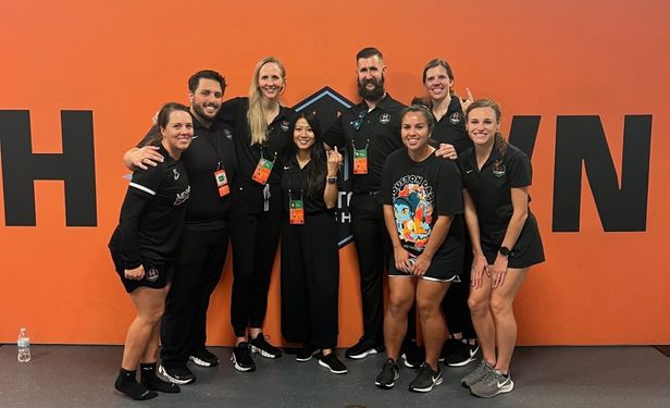 Dr. Bonnie Gregory, orthopedic sports medicine surgeon and team physician for the Houston Dash, stands alongside fellow members of the club's medical and performance staff on match day.