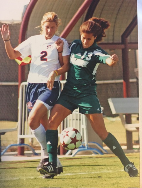 Jessica Traver, MD, playing soccer in college