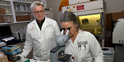 personnel at microscope