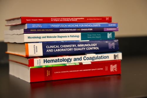 Stack of books used in educational programs