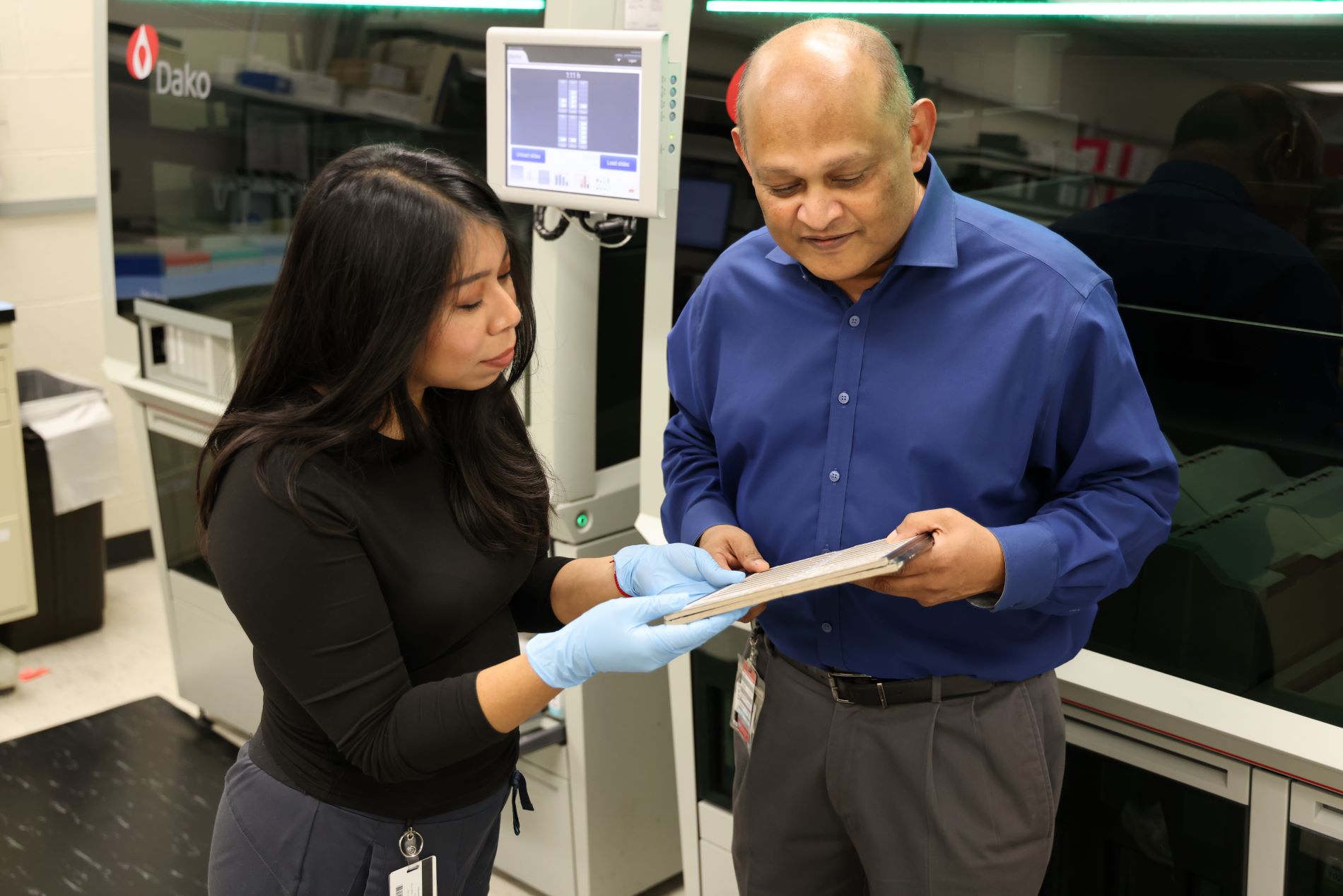 Tech and doctor looking at samples offered as laboratory services