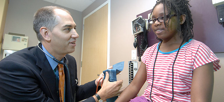 Doctor examining young patient