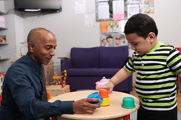 physician with patient at the children's learning institute
