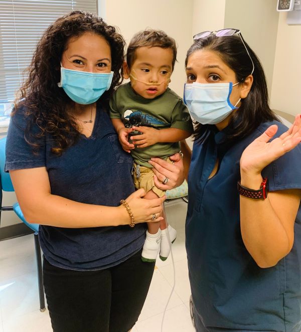 Fatima Boricha, MD, (right) follows both Noah Ordaz (center) and Asher Tate at the UT Physicians Pediatric Center Neonatal High Risk Clinic.