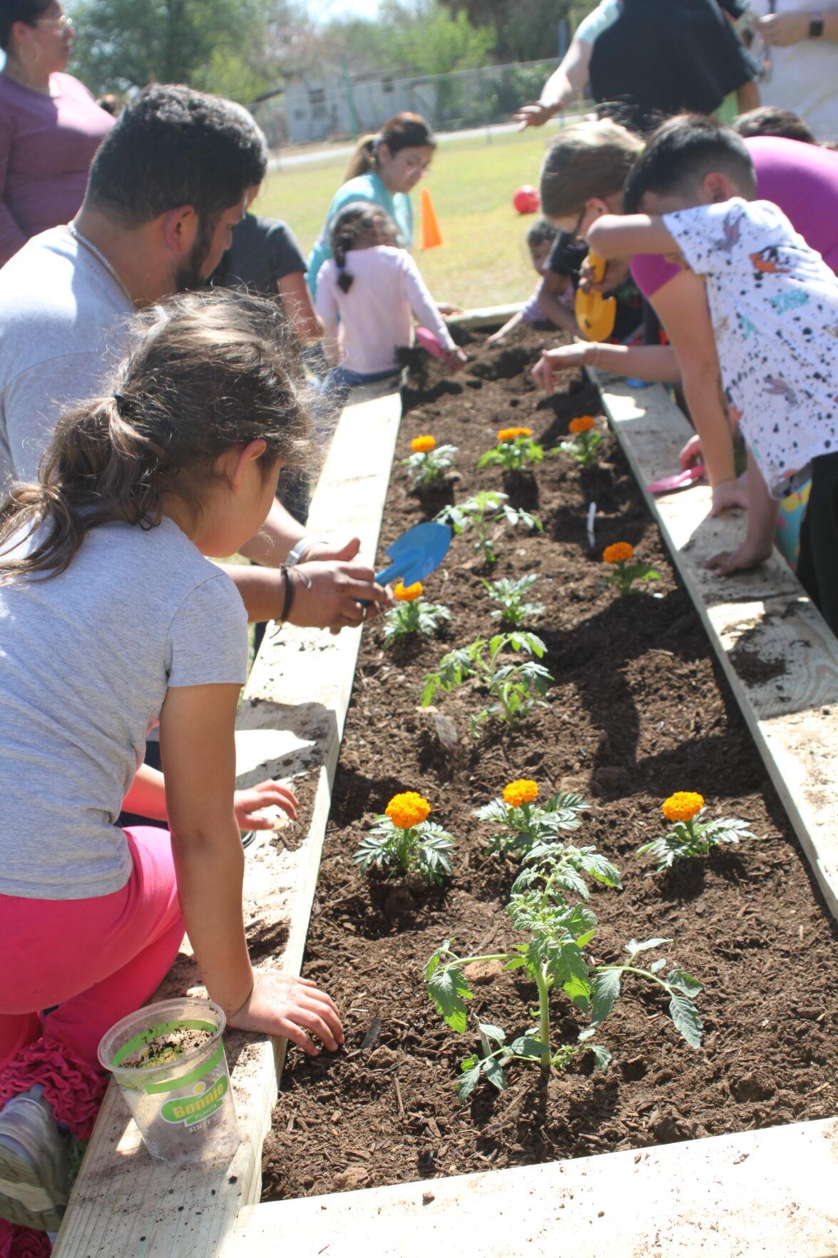 Students and their families worked together to create the first garden at the Children’s Learning Institute. The garden will enhance the school’s science curriculum and provide an opportunity for hands-on learning.