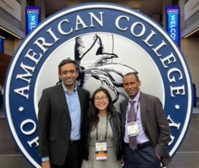 Cardiology fellows with Dr. Adebo at conference.