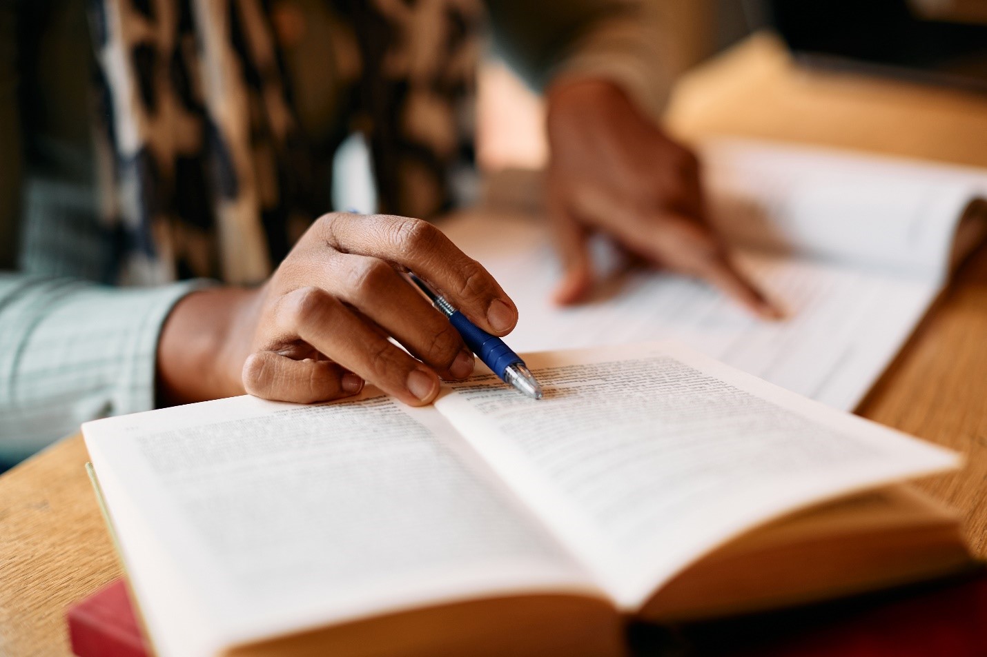 Person reading a research book