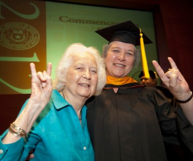 UTHealth Houston graduate poses with UTHealth Houston alumnus