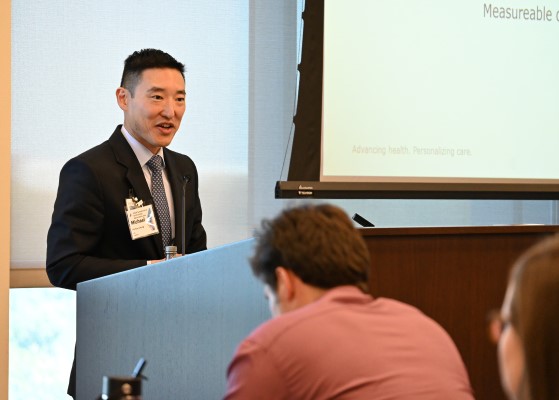 Dr. Chang speaking at podium