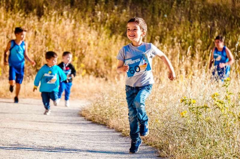 Little boy running and smiling