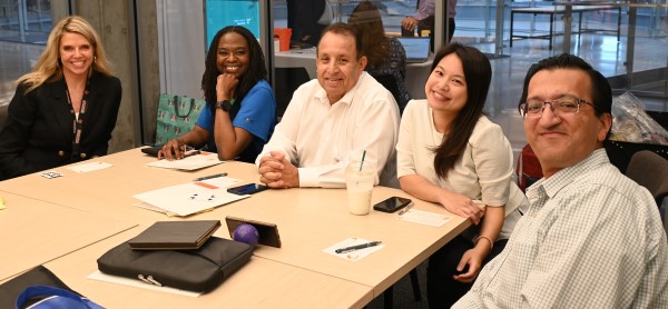 Faculty around a table