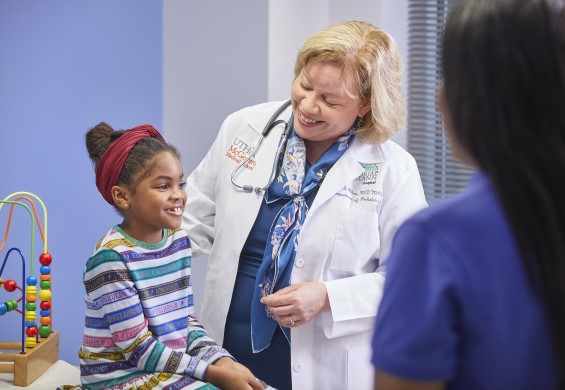 Dr. Aitken interacting with patient